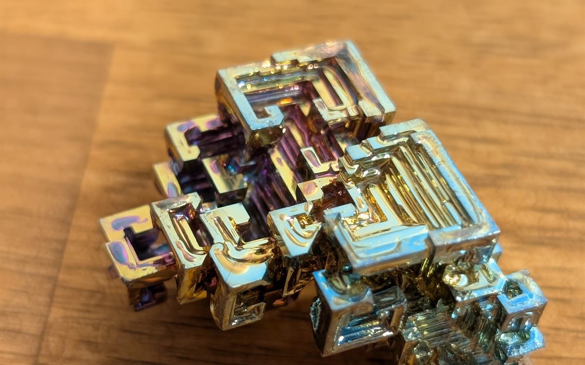A bismuth crystal, stepped and iridescent gold and purple